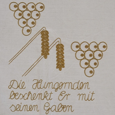 Gesticktes Bild im Hungertuch: Ähren und Trauben 